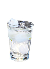 Ice cubes and lemon in a glass
