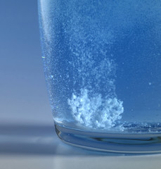 fizzy tablet in a glass of water