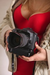 sexy woman with single-lens reflex camera