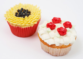 Two cupcakes with decorative techniques