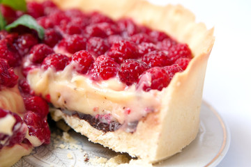 Tart with custard, chocolate and raspberry