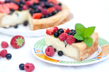 Piece of pie with fresh summer berries and mascarpone