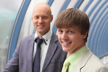 Two businessmen on building