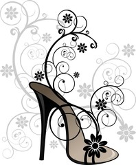 Stylized black sandal with floral decorations