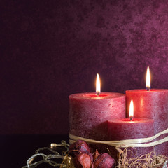 Three candles in purple