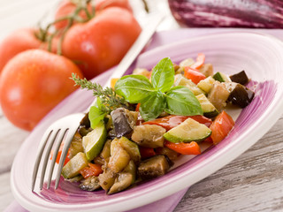ratatouille over dish on white woodden table