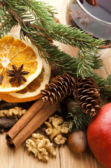 Different kinds of spices, nuts and dried oranges - christmas de