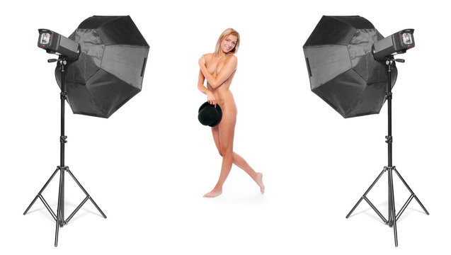 Funny image of a nude showgirl in studio.