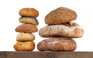 Fototapeta na wymiar Bread loaf and buns on a shelf