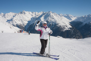 Fototapeta na wymiar Alpine skier mountains in the background