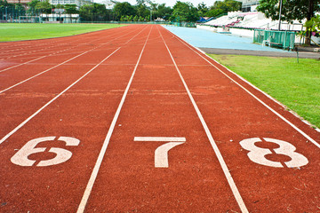 Fototapeta premium Number six seven and eight on the start of a running track