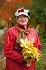 mature woman  in autumn park