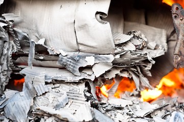 Paper burning in recycle barrel