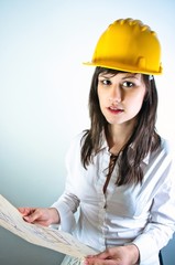 An architect woman holding plans