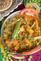 Indian vegetarian dish with paneer and peas in a spicy sauce.