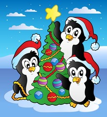 Christmas scene with three penguins