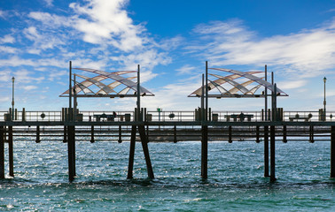 Fototapeta premium Pier with benches and lanterns