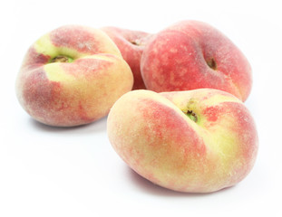 Saturn peaches on white background