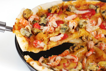 Delicious pizza with seafood on plate isolated on white