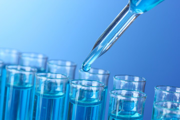 Test-tubes on blue background