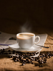 warm cup of coffee on brown background