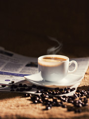 warm cup of coffee on brown background