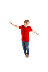 smart boy with red shirt jumping in the air