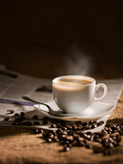 warm cup of coffee on brown background