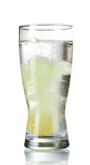 Glass with tablet in water with bubbles isolated on white