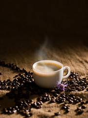 warm cup of coffee on brown background