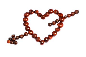 symbol heart with arrow made of chestnuts