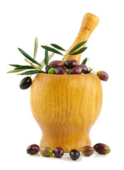 Fresh olives in an  wood mortar