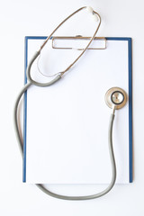 blank clipboard with modern stethoscope