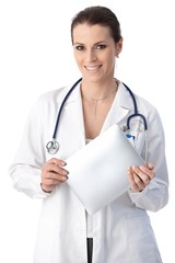 Fototapeta premium Smiling doctor with touchscreen computer