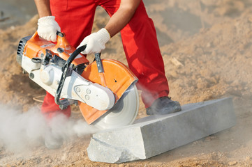 builder at cutting curb work