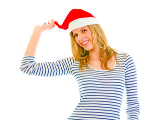 Playful lovely teen girl in Santa hat