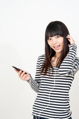 Fototapeta premium pretty asian woman listening music