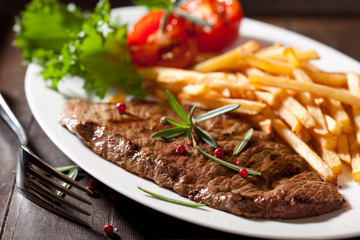 Rustic grilled beefsteak with french fries