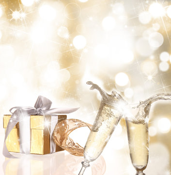 Champagne glasses with golden background