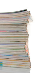 Stack of magazines isolated on white