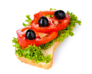 tasty sandwich with cheese and tomatoes isolated on white