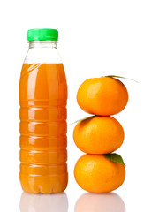 Tangerines and juice bottle isolated on white