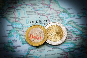 Fototapeta na wymiar Euro coins on a map of Greece (Greek financial crisis)