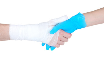 Bandaged hand isolated on white