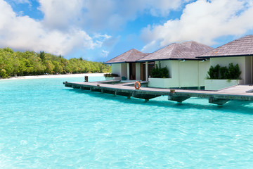 Maldives.Villa on piles on water .