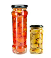 tomatoes canned in glass jar and jar with tinned olives  .