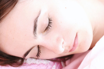 Fototapeta na wymiar Beautiful young woman sleeping.