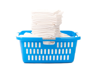 Baby diapers in a blue laundy basket