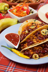 Chili con carne burrito in taco shell