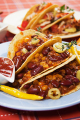 Chili con carne burrito in taco shell